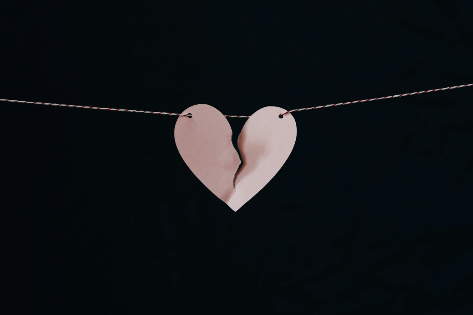 broken heart hanging on wire