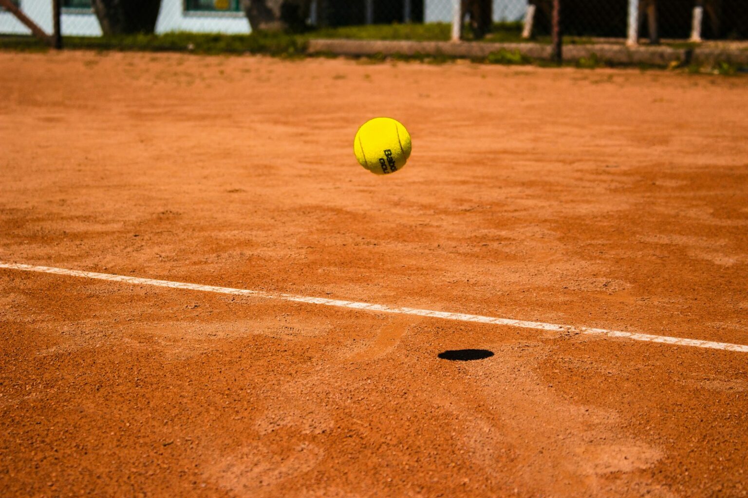 tennis ball bouncing on ground