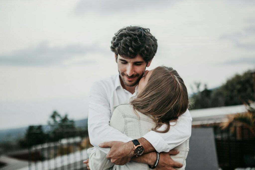 man and woman hugging each other