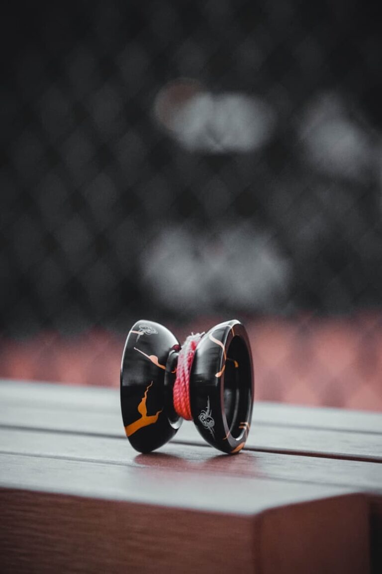a pair of ear buds sitting on top of a wooden table
