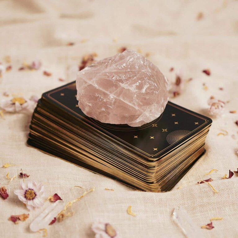 rose quartz on tarot deck
